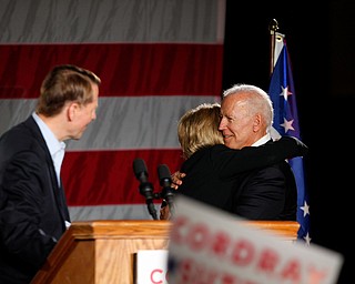 Former U.S. Vice President Joe Biden hugs Richard Cordray's running mate Betty Sutton while Cordray stands at the podium Monday afternoon at Youngstown State University. EMILY MATTHEWS | THE VINDICATOR