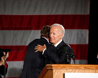 Former U.S. Vice President Joe Biden hugs Ohio gubernatorial candidate Richard Cordray while running mate Betty Sutton stands by Monday afternoon at Youngstown State University. EMILY MATTHEWS | THE VINDICATOR