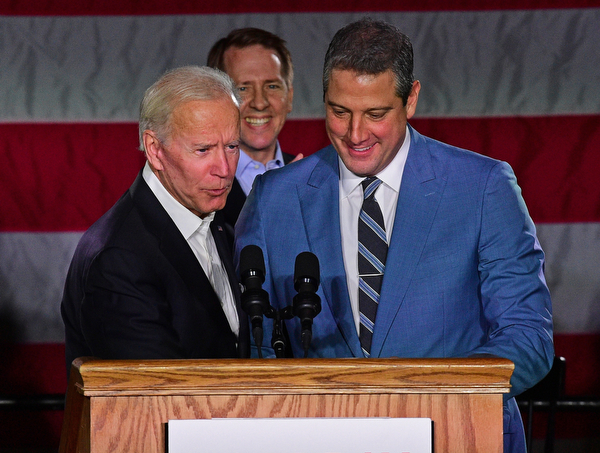 YOUNGSTOWN, OHIO - OCTOBER 29, 2018: Former Vice President of the United States Joe Biden, left, embraces United States Congressmen Tim Ryan at the podium in support of Ohio gubernatorial candidate Richard Cordray, Monday afternoon at Youngstown State University. DAVID DERMER | THE VINDICATOR