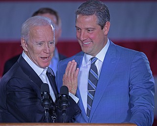 YOUNGSTOWN, OHIO - OCTOBER 29, 2018: Former Vice President of the United States Joe Biden, left, embraces United States Congressmen Tim Ryan at the podium in support of Ohio gubernatorial candidate Richard Cordray, Monday afternoon at Youngstown State University. DAVID DERMER | THE VINDICATOR