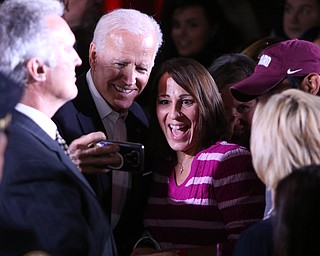 Former Vice President of the United States Joe Biden takes selfies with people who came to hear him speak in support of Ohio gubernatorial candidate Richard Cordray Monday afternoon at Youngstown State University. BOB YOSAY | THE VINDICATOR