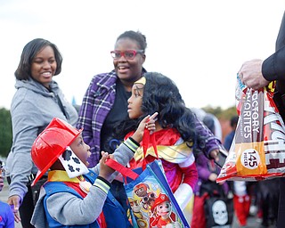 Stephon Rose, 4, center, dressed as Marshall the dalmatian from the television show Paw Patrol, points to a drone he sees while trick or treating at Covelli Centre on Tuesday. EMILY MATTHEWS | THE VINDICATOR