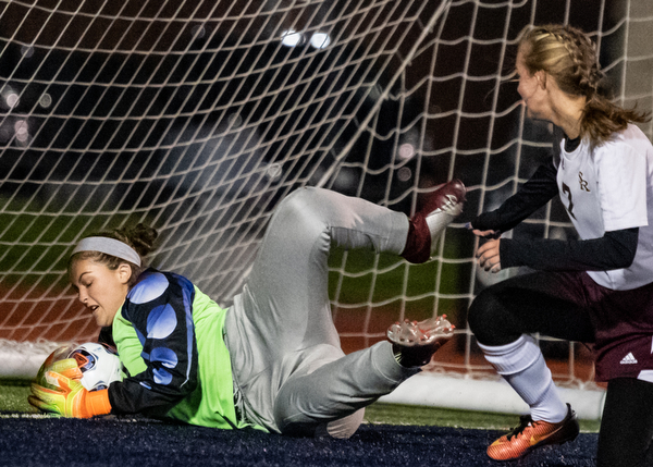 DIANNA OATRIDGE | THE VINDICATOR  South Range goalkeeper Elizabeth Veneskey makes a save in front of teammate Addie Flowers (7) during their Division III regional semifinal in Solon on Tuesday.