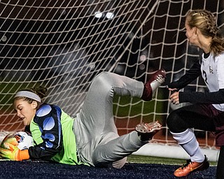 DIANNA OATRIDGE | THE VINDICATOR  South Range goalkeeper Elizabeth Veneskey makes a save in front of teammate Addie Flowers (7) during their Division III regional semifinal in Solon on Tuesday.