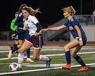 DIANNA OATRIDGE | THE VINDICATOR  South Range's Rachel Maynard (12) tries to keep the ball away from Kirtland's Tea Petric during their Division III regional semifinal in Solon on Tuesday.