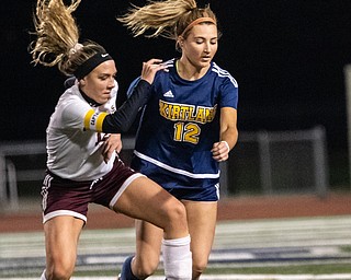DIANNA OATRIDGE | THE VINDICATOR  South Range's Rachel Maynard (12) and Kirtlands' Tea Petric battle for possession of the ball during their Division III regional semifinal in Solon on Tuesday.
