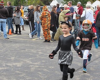 Neighbors | Jessica Harker.Students at Boardman's Stadium Drive Elementary School walked through the parking lot in the annual Halloween parade on Oct. 26.