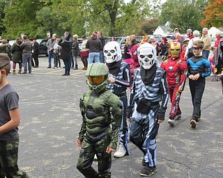 Neighbors | Jessica Harker.Students marched around the parking lot of Stadium Drive Elementary School on Oct. 26 to show off their Halloween costumes to family and community members gathered.