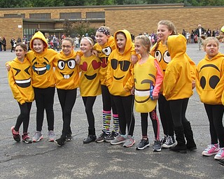 Neighbors | Jessica Harker.A group of third-graders at Stadium Drive Elementary School dressed as emojis and walked around the parking lot on Oct. 26 for the annual Halloween parade.