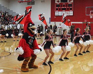 Neighbors | Abby Slanker.Joined by Big Red, members of the Canfield High School cheerleading squads performed cheers and dances for their fellow students at the school’s Spirit Week pep rally on Oct. 26.