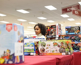 Landen Fitzgerald-Green, 8, looks at toys in the Burlington store in Boardman during a shopping spree his family received to celebrate his recovery from Leukemia on Thursday. EMILY MATTHEWS | THE VINDICATOR