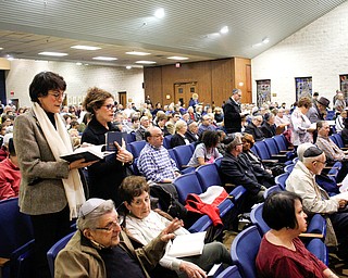 Attendees of an interfaith vigil for the Pittsburgh Tree of Life Synagogue victims participate in prayer at Temple El Emeth in Liberty on Thursday evening. EMILY MATTHEWS | THE VINDICATOR