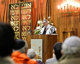 Rabbi Schonberger leads Minyan Service at the beginning of an interfaith vigil for the Pittsburgh Tree of Life Synagogue victims at Temple El Emeth in Liberty on Thursday evening. EMILY MATTHEWS | THE VINDICATOR