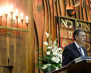 Aaron Hively, President of the Congregation Rodef Sholom, speaks during an interfaith vigil for the Pittsburgh Tree of Life Synagogue victims at Temple El Emeth in Liberty on Thursday evening. EMILY MATTHEWS | THE VINDICATOR