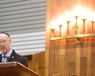 Rob Elston, the YAJF Security Director, speaks during an interfaith vigil for the Pittsburgh Tree of Life Synagogue victims at Temple El Emeth in Liberty on Thursday evening. EMILY MATTHEWS | THE VINDICATOR