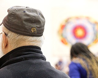 Alvin Weisberg, of Squirrel Hill, wears a University of Pittsburgh Panthers hat during an interfaith vigil for the Pittsburgh Tree of Life Synagogue victims at Temple El Emeth in Liberty on Thursday evening. EMILY MATTHEWS | THE VINDICATOR