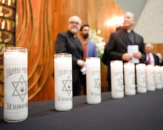 Candles that represent the victims of the shooting at the Tree of Life Synagogue in Pittsburgh are displayed during an interfaith vigil for the Pittsburgh Tree of Life Synagogue victims at Temple El Emeth in Liberty on Thursday evening. EMILY MATTHEWS | THE VINDICATOR