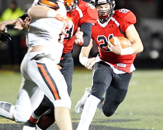 Canfield's Nick Crawford runs with the ball during the first half of their game against Marlington at Canfield on Friday. EMILY MATTHEWS | THE VINDICATOR