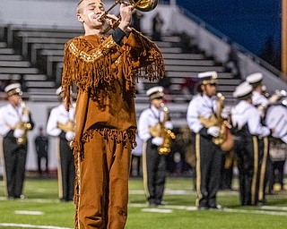 DIANNA OATRIDGE | THE VINDICATOR The Warren Harding mascot plays the trombone during the pre game ceremonies  for the Harding and Garfield Heights first round match up at Mollenkopf Stadium in Warren on Friday.