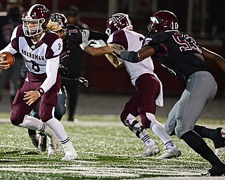 MAPLE HEIGHTS, OHIO - NOVEMBER 2, 2018: Boardman's Mike O'Horo runs the ball away from Maple Heights' Charles Medley during the 1st half of their OHSAA Division II playoff game, Friday night at Maple Heights High School. DAVID DERMER | THE VINDICATOR