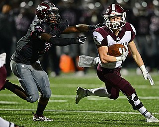 MAPLE HEIGHTS, OHIO - NOVEMBER 2, 2018: Boardman's Joe Ieraci runs before being drug down by Maple Heights' Manny Ramsey during the 1st half of their OHSAA Division II playoff game, Friday night at Maple Heights High School. DAVID DERMER | THE VINDICATOR