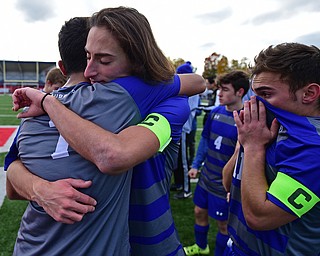 NILES, OHIO - NOVEMBER 3, 2018: Hubbard's A.J. Trobek, center, is embraced by Nader Kassem after Hubbard was defeated 2-1 by Revere in the OHSAA Division 2 Regional Finals, Saturday afternoon at Niles High School. Hubbard's Michael VanSuch pictured. DAVID DERMER | THE VINDICATOR