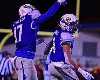 HUBBARD, OHIO - NOVEMBER 3, 2018: Hubbard's Davion Daniels, right, is congratulated by Shannon Slovesko after scoring a touchdown during the first half of their OHSAA Division IV playoff game, Saturday night at the Hubbard football stadium. DAVID DERMER | THE VINDICATOR