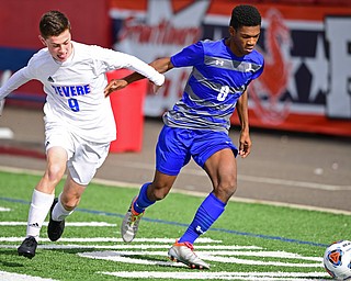 NILES, OHIO - NOVEMBER 3, 2018: Hubbard's Derrick Cobbin, right, battles with Revere's Owen Alexander during the first half of the OHSAA Division 2 Regional Finals, Saturday afternoon at Niles High School. Hubbard's Michael VanSuch pictured. DAVID DERMER | THE VINDICATOR