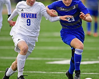 NILES, OHIO - NOVEMBER 3, 2018: Anthony Gagliardi battles with Revere's Owen Alexander for the ball during the second half of the OHSAA Division 2 Regional Finals, Saturday afternoon at Niles High School. Hubbard's Michael VanSuch pictured. DAVID DERMER | THE VINDICATOR