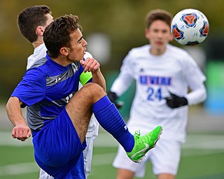 NILES, OHIO - NOVEMBER 3, 2018: Hubbard's Michael VanSuch battles with Revere's Owen Alexander for the ball during the second half of the OHSAA Division 2 Regional Finals, Saturday afternoon at Niles High School. Hubbard's Michael VanSuch pictured. DAVID DERMER | THE VINDICATOR