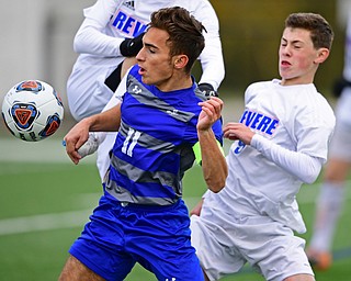 NILES, OHIO - NOVEMBER 3, 2018: Hubbard's Michael VanSuch battles with Revere's Owen Alexander for the ball during the second half of the OHSAA Division 2 Regional Finals, Saturday afternoon at Niles High School. Hubbard's Michael VanSuch pictured. DAVID DERMER | THE VINDICATOR