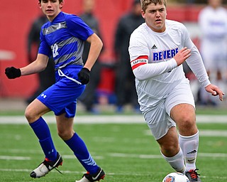 NILES, OHIO - NOVEMBER 3, 2018: Revere's Sam Webster dribbles the ball away from Hubbard's Jacob Guly during the second half of the OHSAA Division 2 Regional Finals, Saturday afternoon at Niles High School. Hubbard's Michael VanSuch pictured. DAVID DERMER | THE VINDICATOR