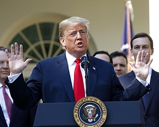 In this Monday, Oct. 1, 2018, file photo, President Donald Trump speaks as he announces a revamped North American free trade deal, in the Rose Garden of the White House in Washington. President Donald Trump insists his new North American trade deal will deliver a victory for U.S. factory workers by returning many high-paying jobs to the United States. Maybe. But a review of the agreement suggests that job gains for the U.S. would likely mean higher prices for consumers and more inefficiencies for businesses. The biggest winners might end up being robots and the companies that make them.