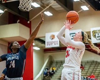 DIANNA OATRIDGE | THE VINDICATOR  Youngstown State's McKenah Peters puts up a shot over Robert Morris's Irekpitan Ozzy-Momodu during their game at Beeghly Center in Youngstown on Tuesday.