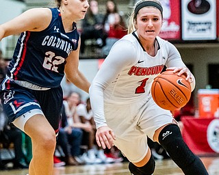 DIANNA OATRIDGE | THE VINDICATOR  Youngstown State's Alison Smolinski (2) drives to the hoop against Robert Morris's Esther Castedo (22) during their game at Beeghly Center in Youngstown on Tuesday.