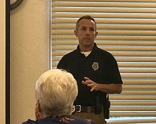 Neighbors | Jessica Harker.Officer Keith Smith presented at the Austintown library on Oct. 9 to community members about how a civilian can respond to an active shooter situation.