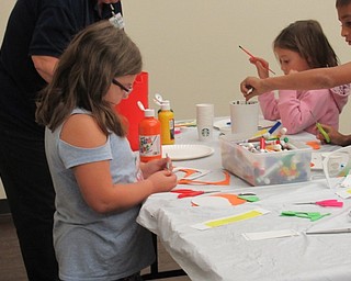 Neighbors | Jessica Harker.The Boardman library provided supplies that children were able to use to create foam magnets that they decorated to fit the Halloween theme.