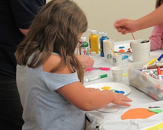 Neighbors | Jessica Harker.Sarah Marobich, age 7, attended the Halloween themed story time at the Boardman library Oct. 11 where she created a foam magnet.