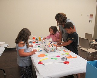 Neighbors | Jessica Harker.Children gathered at the Boardman library Oct. 11 and participated in a Halloween craft where they painted magnets that they were able to take home.