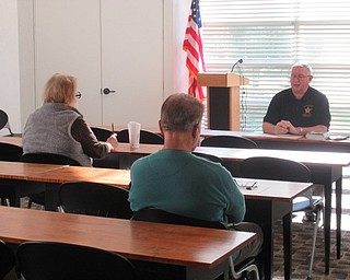 Neighbors | Jessica Harker .Rober Shaeffer discussed security with seniors gathered at the Austintown library Oct. 17 for the Fraud and Security event.