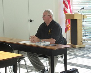 Neighbors | Jessica Harker .Robert Shaeffer spoke with community members about how to avoid dangerous situations and fraud at the Austintown library.