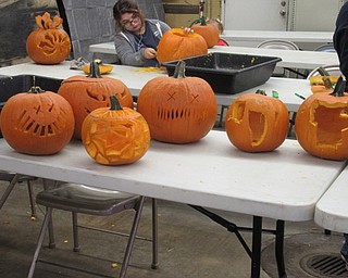 Neighbors | Jessica Harker .A group of pumpkins carved by the Zink family were on display at the Service Building Oct. 12 for the annual Pumpkin Walk event held at Fellows Riverside Garden.