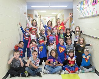Neighbors | Jessica Harker.Students dressed as superheroes posed with, from left, (back) Mrs. Patrick, Mrs. Banko and Kristin Havaich on Oct. 25 for Red Ribbon Week's superhero day.