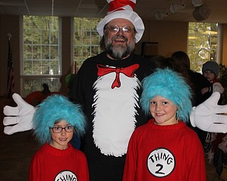 Neighbors | Abby Slanker.Canfield Presbyterian Church pastor Rev. Larry Bowald, dressed as The Cat in the Hat, found his friends in Thing 1, Ava Connelly, and Thing 2, Alexandra Skopic, at the church’s annual Trunk or Treat event on Oct. 24.