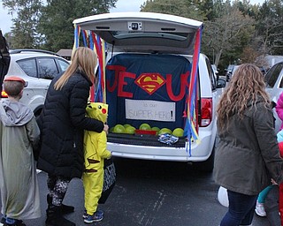 Neighbors | Abby Slanker.Attendees of the Canfield Presbyterian Church annual Trunk or Treat checked out a trunk with a religious, superhero theme.