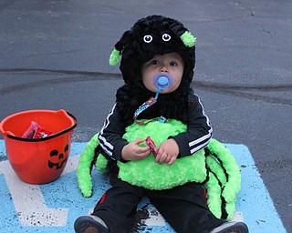 Neighbors | Abby Slanker.Zachary Horvath of Canfield couldn’t wait to dig into his candy after he paraded through the Canfield Presbyterian Church annual Trunk or Treat event on Oct. 24.
