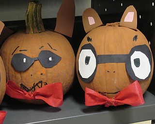 Neighbors | Jessica Harker.Students in Mrs. Donahue's second grade classroom decorated pumpkins like characters from books they have read like Arthur.