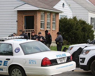  ROBERT K.YOSAY  | THE VINDICATOR...after a triple homicide at Gibson St and Pasadena Ave on the city's southside Wed Night officers detained a car and arrested the driver on charges of drug paraphernalia and a gun..