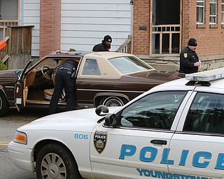  ROBERT K.YOSAY  | THE VINDICATOR...after a triple homicide at Gibson St and Pasadena Ave on the city's southside Wed Night officers detained a car and arrested the driver on charges of drug paraphernalia and a gun..