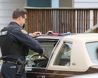  ROBERT K.YOSAY  | THE VINDICATOR...after a triple homicide at Gibson St and Pasadena Ave on the city's southside Wed Night officers detained a car and arrested the driver on charges of drug paraphernalia and a gun..